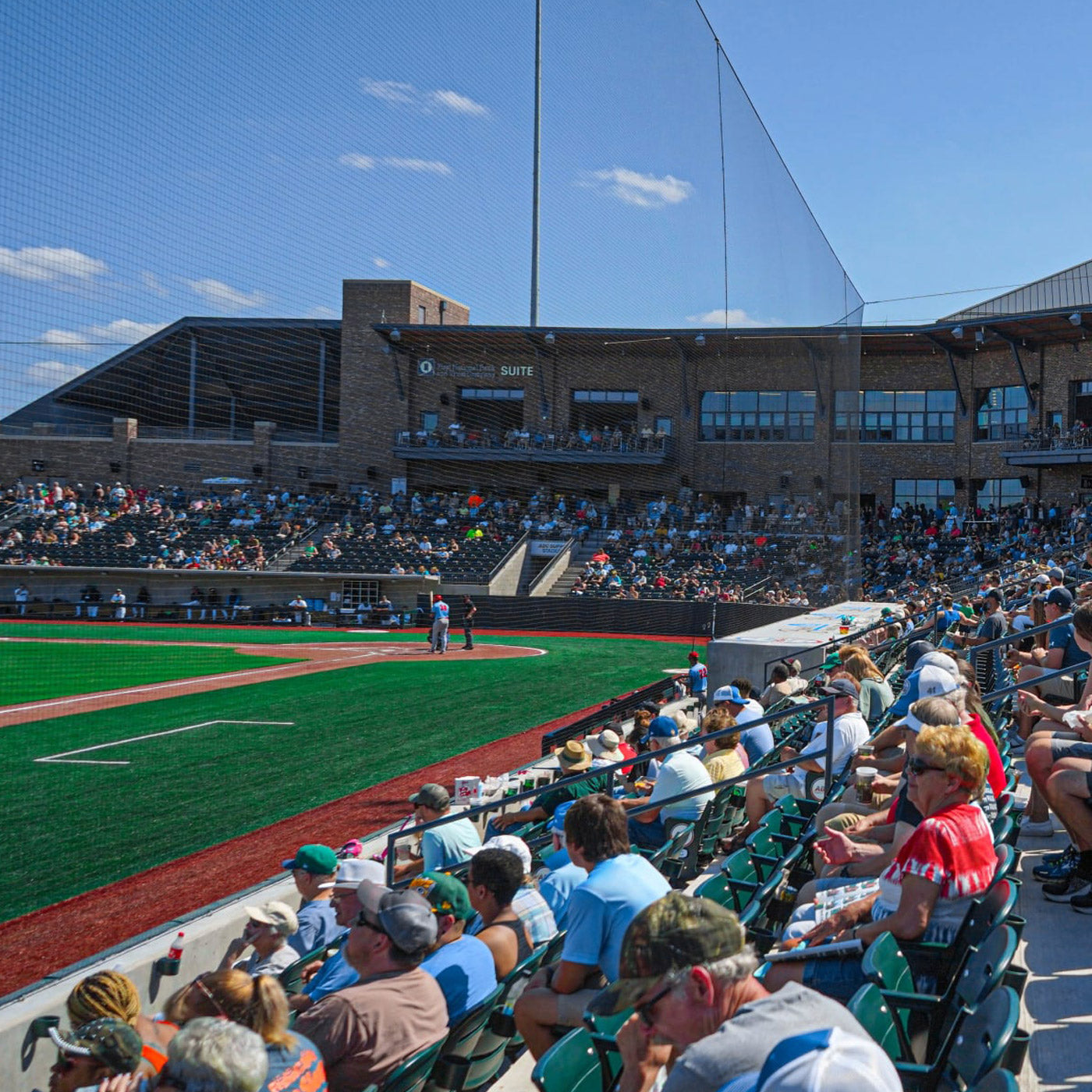 Crowd watching baseball game at ABC Supply Stadium