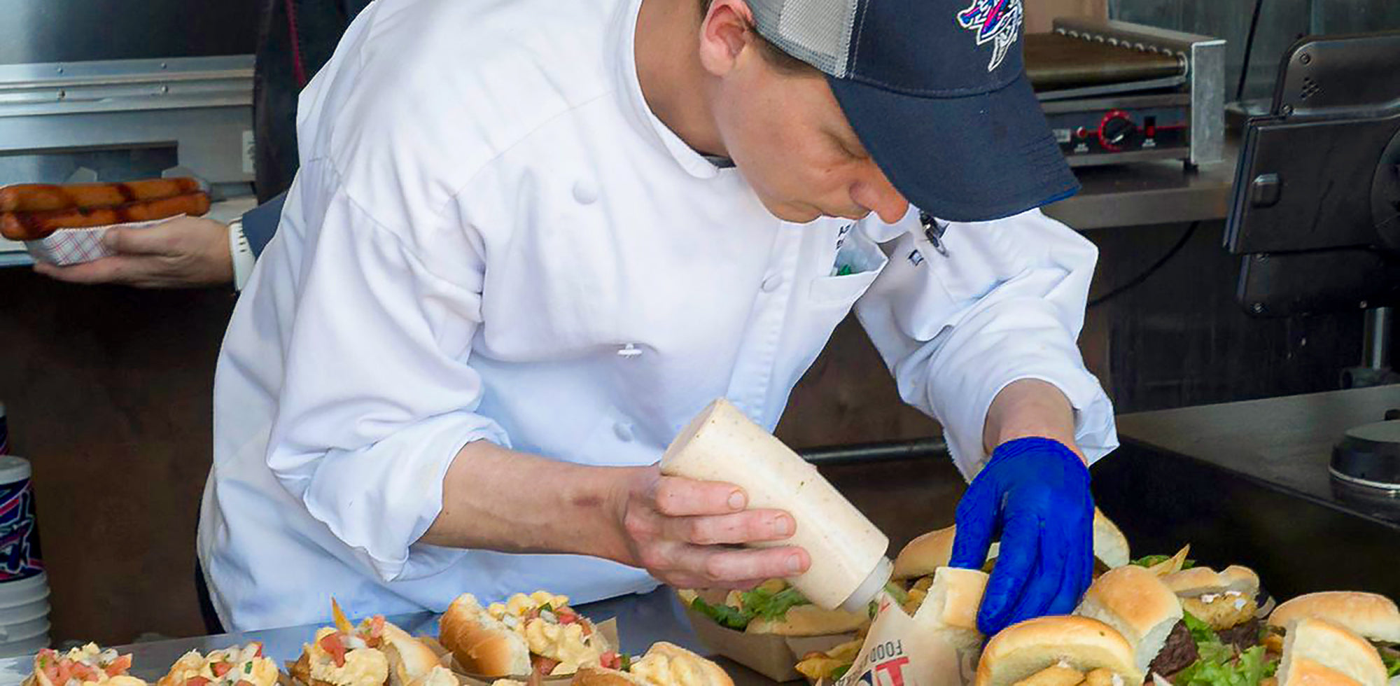 RS3 staff preparing food in a kitchen
