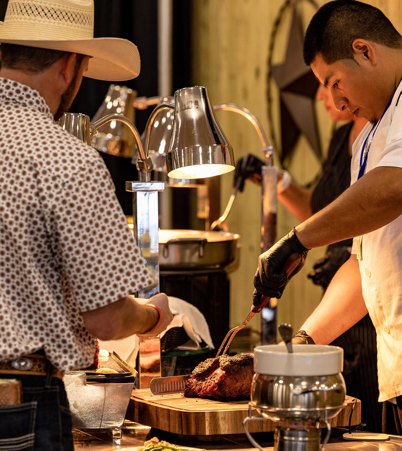 Chef slicing and serving meat at Austin Rodeo event