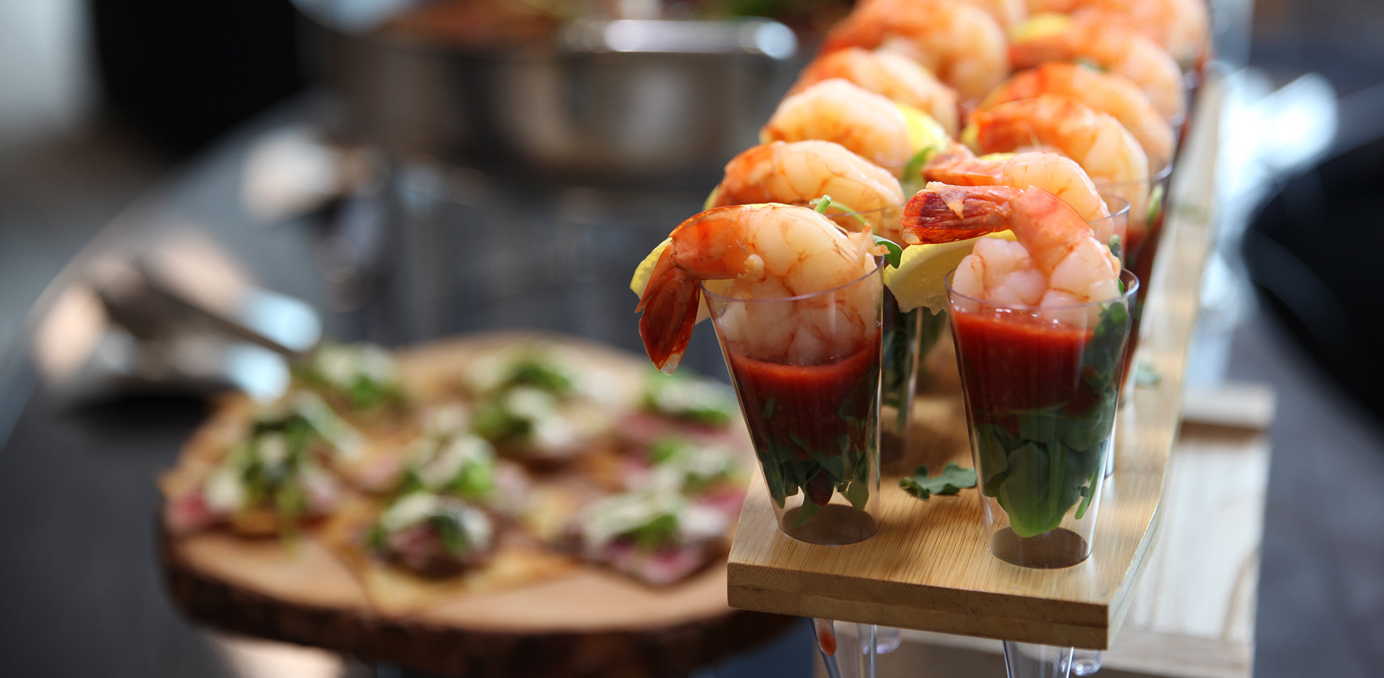 Shrimp cocktail in small glasses on buffet table